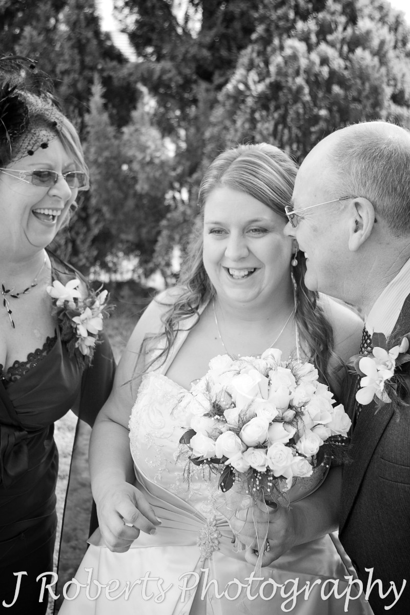 Bride laughing with her parents - wedding photography sydney